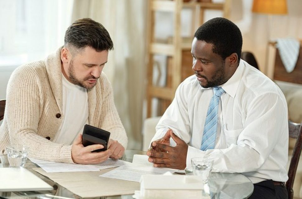 Adult man with adviser accounting house price