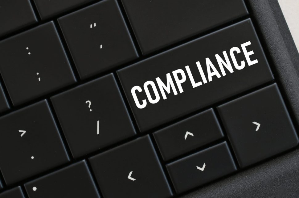 computer-keyboard-with-a-compliance-button-concept-8PNSTAU