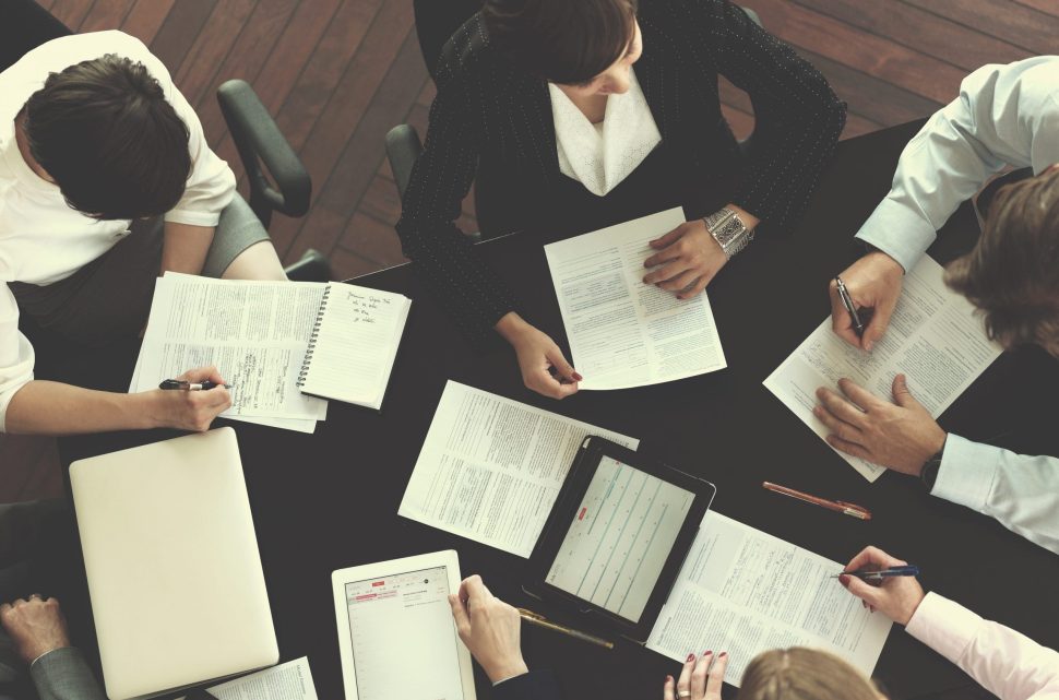 top-view-of-business-people-group-on-meeting-P3TY7XV-scaled